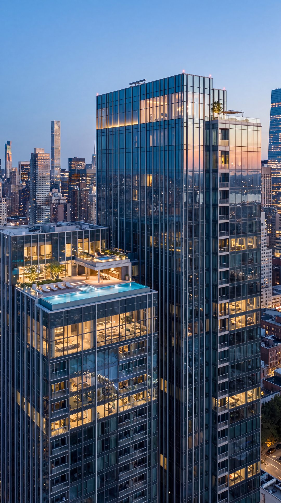 Penthouse with a rooftop infinity pool and terrace on a glass tower at dusk (representative image)